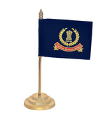 Front view desk flag: navy flag with golden crest and ribbon, on brass base