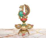 Brass peacock oil lamp with five diya bowls, sculpted stand and colorful accents