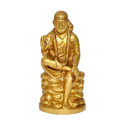 Brass Shirdi Sai Baba idol, seated figure with folded hands and raised gesture