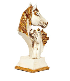Polyresin double horse head ornament in white and gold, angled view on pedestal