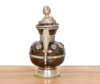 Brass teapot front view with finial lid, vertical ridge detail, dark brown body