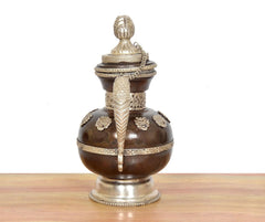 Brass teapot front view with finial lid, vertical ridge detail, dark brown body