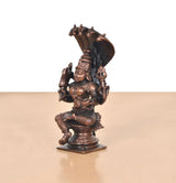 Other side view: copper goddess idol with multiple arms, cobra hoods behind, 5 inch