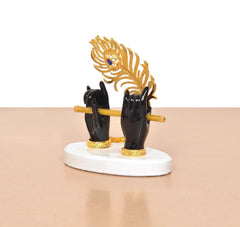 Black Krishna hands holding flute with gold peacock hood, white round stand