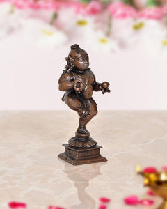 Copper Bal Krishna dancing figurine, 3.5 in, reverse angle on pedestal