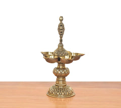 Bronze five-diya oil lamp stand, side view with five shallow bowls and base
