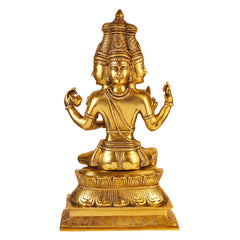 Brass deity statue with ornate crown, seated on pedestal with four-armed hands