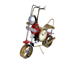 Metal bicycle statue with silver headlight, round clock, red accents and springs