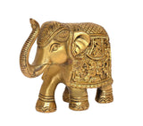 Brass elephant figurine, close view of head and trunk with ornate patterned back