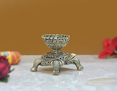 Brass tortoise oil lamp diya statue, three-quarter angle with textured scaly legs