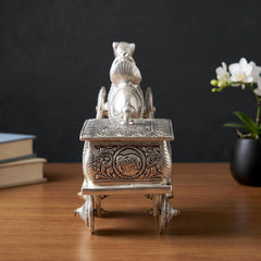 Silver metal camel chariot with detailed carved front panel and open wheel base
