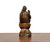 Brass Shirdi Sai Baba statue rear view, seated posture with folded hands