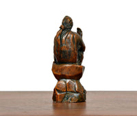 Brass Shirdi Sai Baba statue rear view, seated posture with folded hands