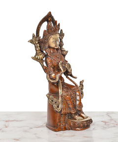 Brass Tara Devi statue side angle, standing support base with ornate arm details