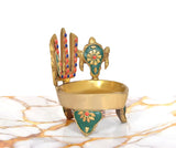 Brass oil lamp with teal corner panel, chakra back symbol, and small flame-bowl top