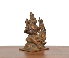 Copper Lakshmi Narasimhar idol, angled view of raised hands and carved base