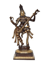 Brass Saraswati standing statue playing sitar, side view with detailed ornaments