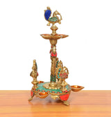 Peacock diya stand in brass with tall centerpiece and five orange oil cups