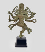 Bronze Shiva Nataraj dancing statue, three-quarter angle with intricate torso details and base