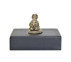 Brass Nandi bull figurine on dark rectangular base, back view