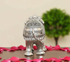 Silver elephant figurine, 3-inch height, front view with patterned body.