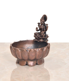 Copper Lakshmi Maa urli bowl with goddess idol, side view of round basin