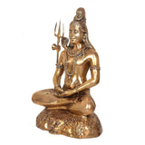 Brass Shiva statue side view, seated in meditation with trident, carved lion-style base