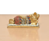 Brass Ganesha relaxing statue, side view showing multicolor jeweled bands