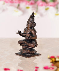 Copper Maa Annapurna statue, side view, seated holding a ritual item, 3.5 in