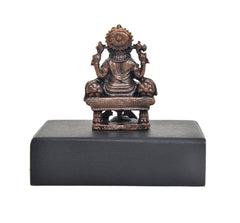Copper Lord Ganesha idol rear view on square dark pedestal base