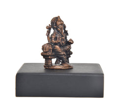 Copper Lord Ganesha idol angled view on square dark pedestal base