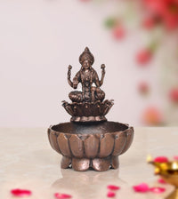 Copper Lakshmi Maa urli bowl, 3-inch height, seated goddess on lotus base.