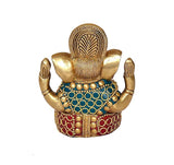 Brass Ganesha statue back view with ornate crown and blue-red beaded detailing