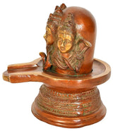 Side view of Trimukhi Shiva Lingam statue on round pedestal, detailed brass faces