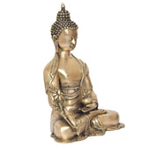 Brass meditating Buddha idol, three-quarter view with folded legs and hand pose