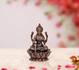 Copper Lakshmi idol statue on lotus base, seated pose, detailed jewelry and headdress