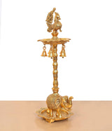 Golden peacock oil lamp holder with side view, elephant base tray and hanging bells