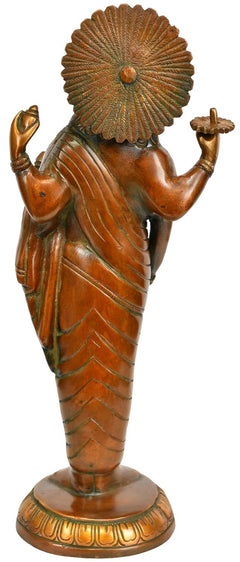Brass Dhanvantari statue from back/side, ornate fan-like halo and flowing drape