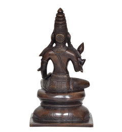 Bronze Parvati seated idol, back view with tall finial headdress and draped details