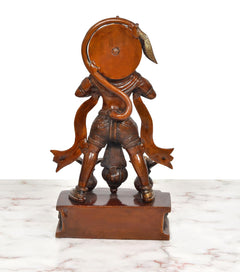 Brass Hanuman idol back view, arched headgear and long tail, engraved base