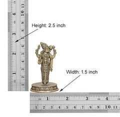Small brass standing deity figurine shown with measuring ruler, 2.5 in height