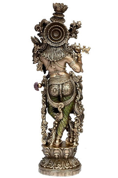 Krishna resin idol side view, ornate back detailing, raised hand and flute, standing