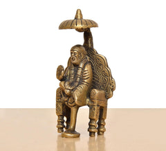 Brass Shirdi Sai Baba statue, side view with detailed back pattern and umbrella canopy