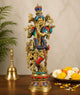 Multicolor brass Krishna idol figurine with crown, flute, and ornate arms, full view