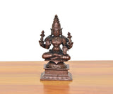 Copper Lakshmi Maa idol, seated figure with raised hands and ornate crown, on pedestal base