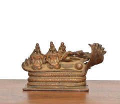 Copper Sheshashayi Vishnu idol with Lakshmi and Bhudevi, front legs and attendants