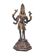 Brass Shiva standing figurine with four raised arms, detailed jewelry, round base