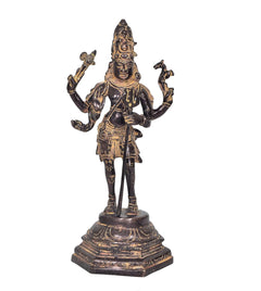 Brass Shiva standing figurine with four raised arms, detailed jewelry, round base