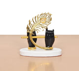 Black resin Krishna hands with flute, gold peacock hood, white circular base