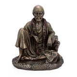 Resin Shirdi Sai Baba statue, seated figure with flower garlands and robe